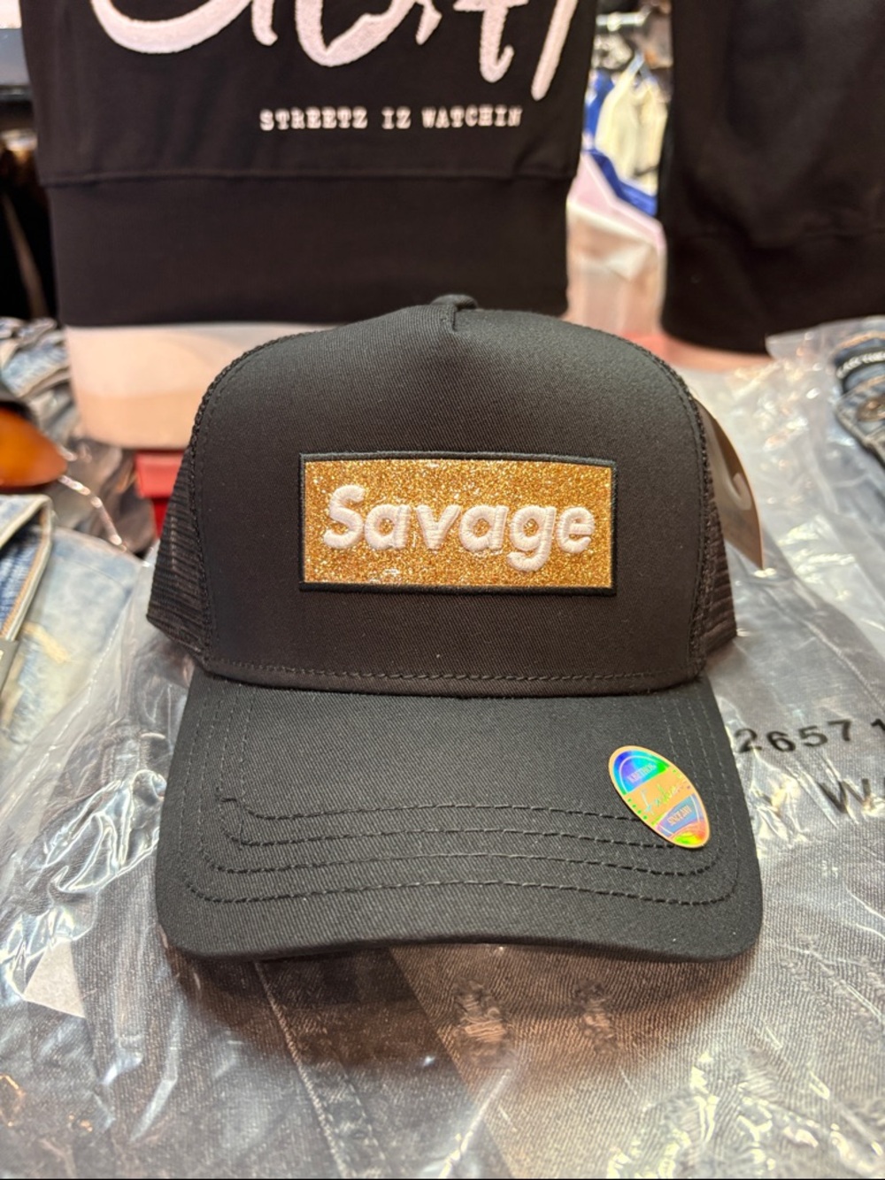 Black Trucker Hat with Gold 'Savage' Patch
